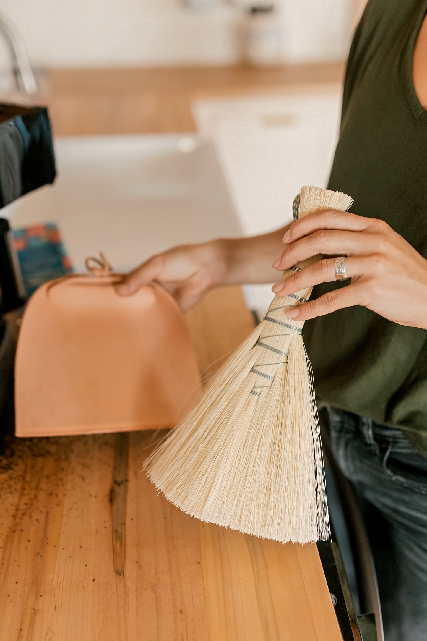 Metal wrapped brushes and brooms
