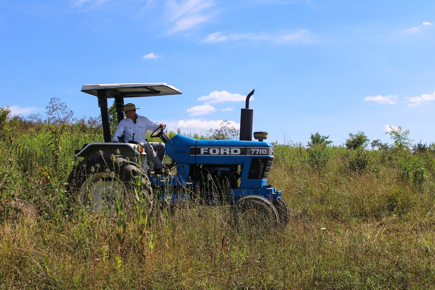 farmer-on-tracker-in-field