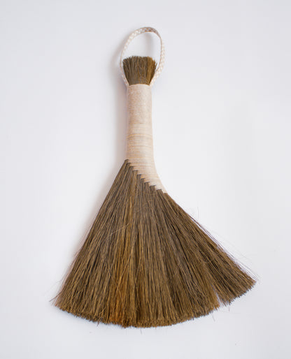 Dark-Tampico-handbroom-with-pink-threaded-handle 