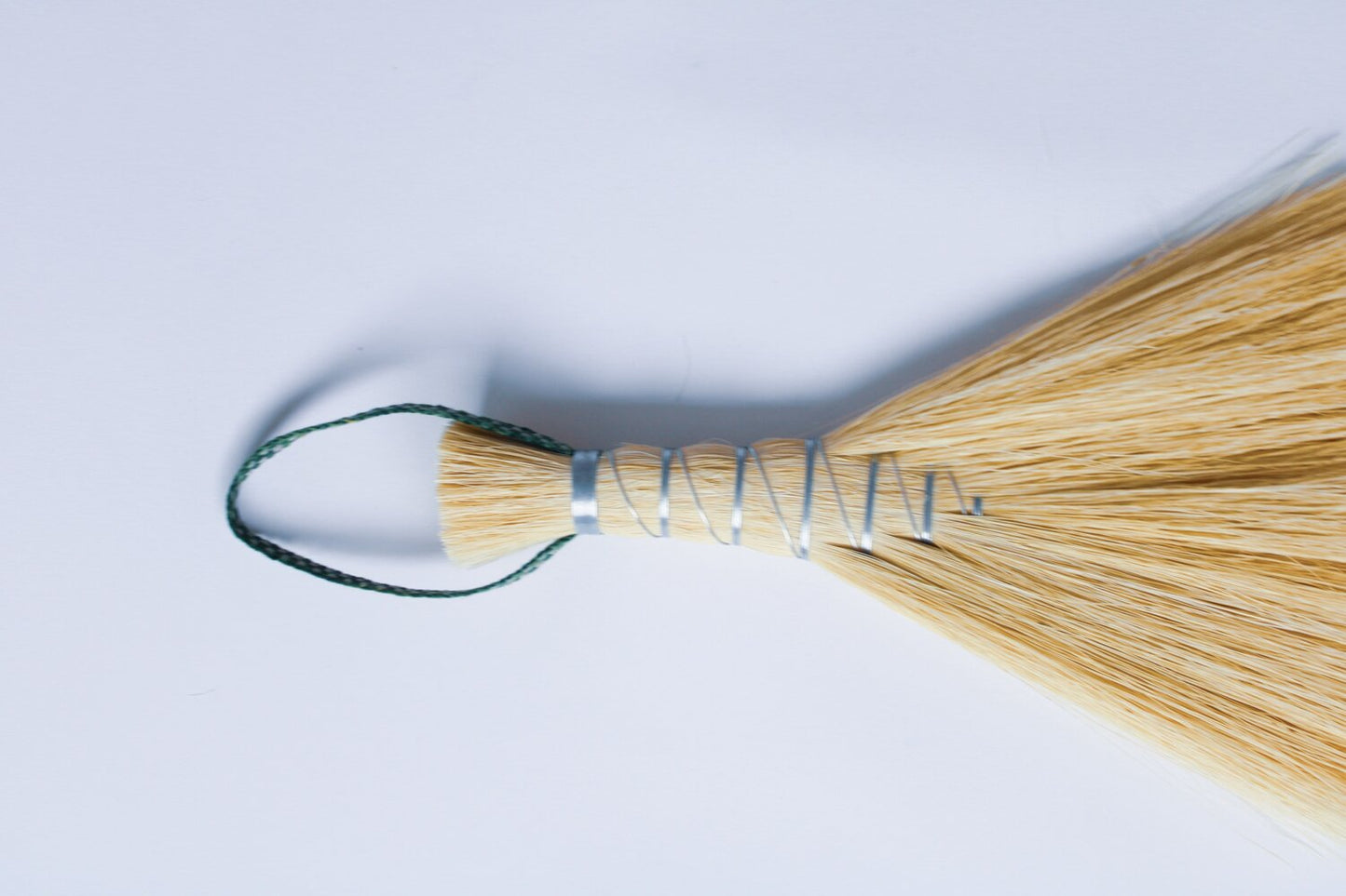 Metal wrapped brushes and brooms