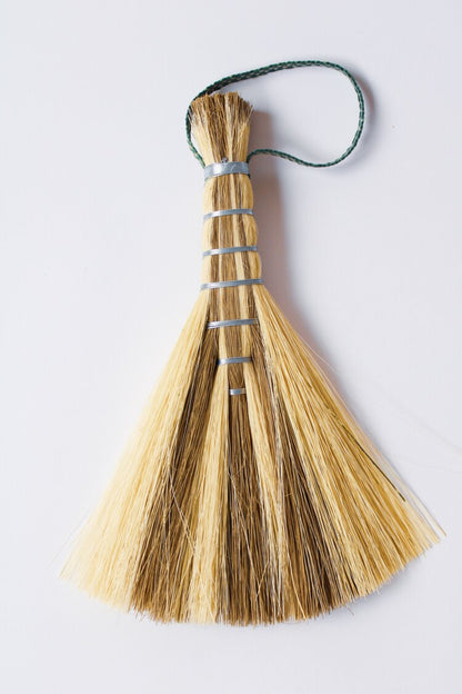 Metal wrapped brushes and brooms