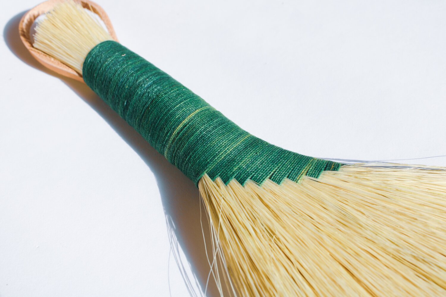 hand-brush-with-green-threaded-handle