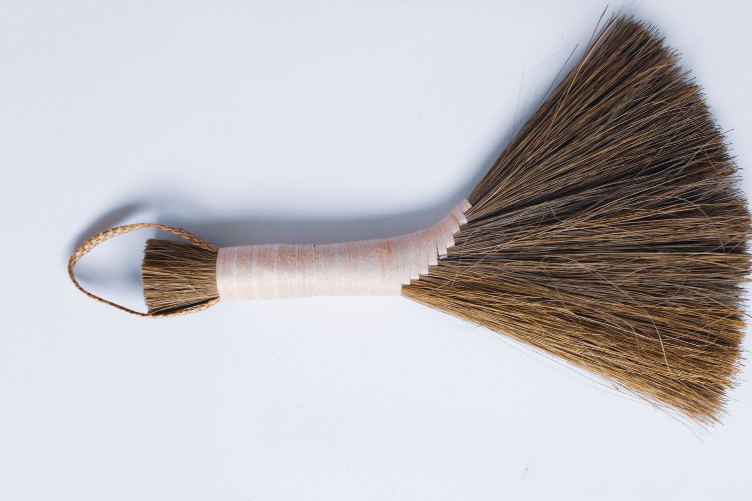 Dark-Tampico-handbroom-with-pink-threaded-handle