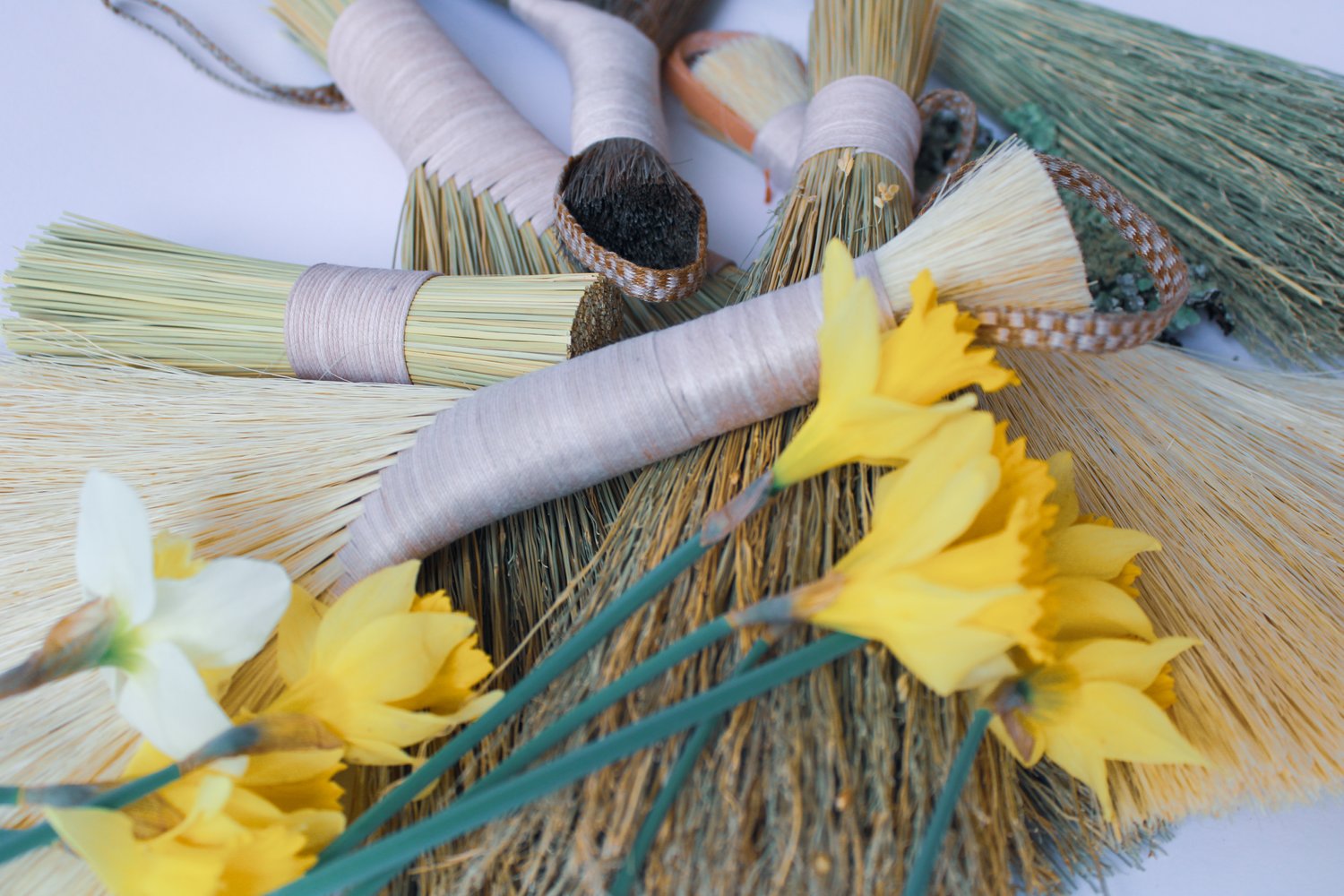 Many-Tampico-and-Dark-Tampico-handbrooms-with-pink-threaded-handles-and-flowers