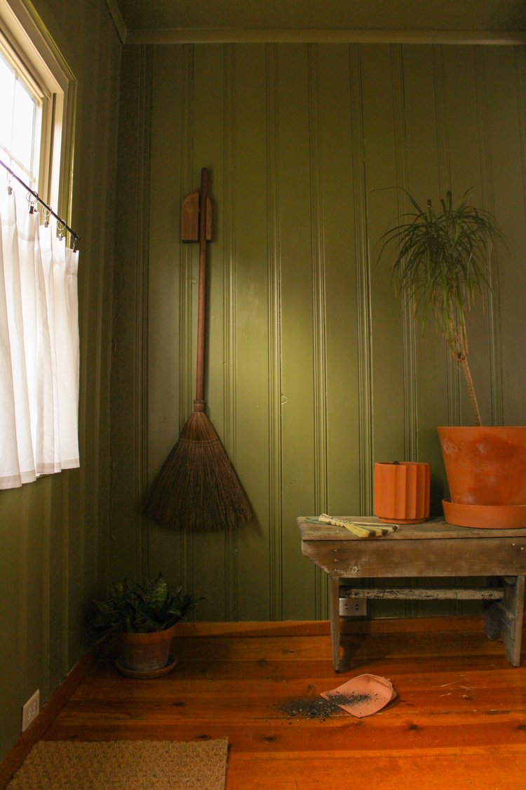 Walnut-Dutch-broom-hanger-set-on-wall